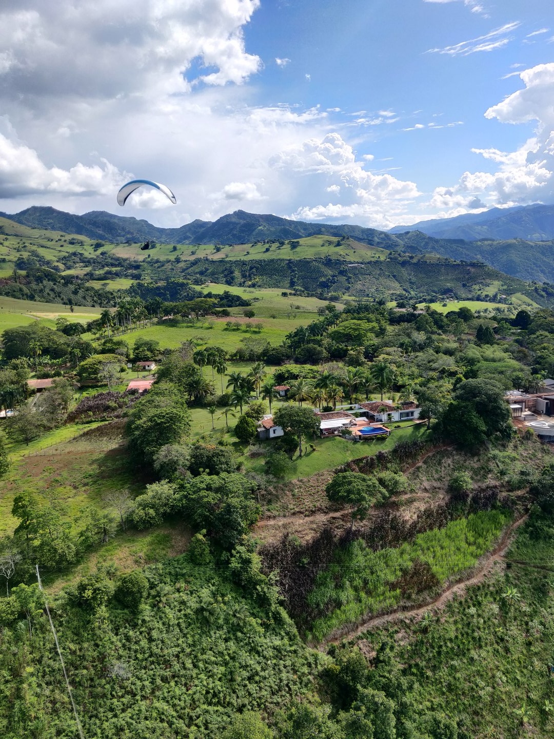Paragliding above luxury homes